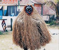 Traditional straw masquerade costume with mask